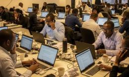 Image of journalists in a newsroom courtesy of Artificial Intelligence (AI).